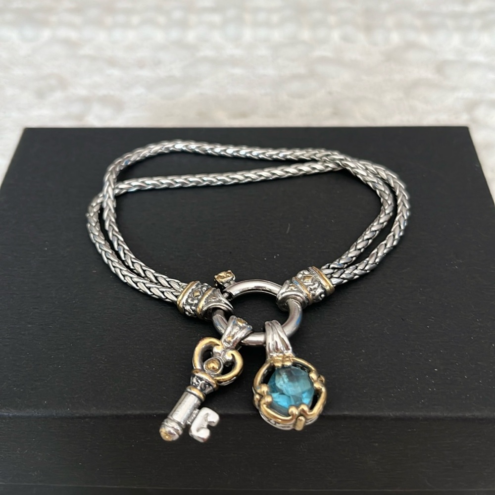 Double strand charm bracelet with 2 charms.